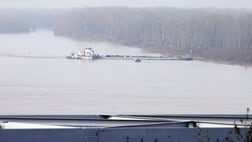 The Coast Guard says oil spilled from at least one of two oil barges that were heavily damaged when they hit a railroad bridge over the Mississippi River at Vicksburg.